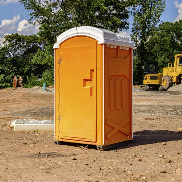 what is the cost difference between standard and deluxe portable restroom rentals in Hills IA